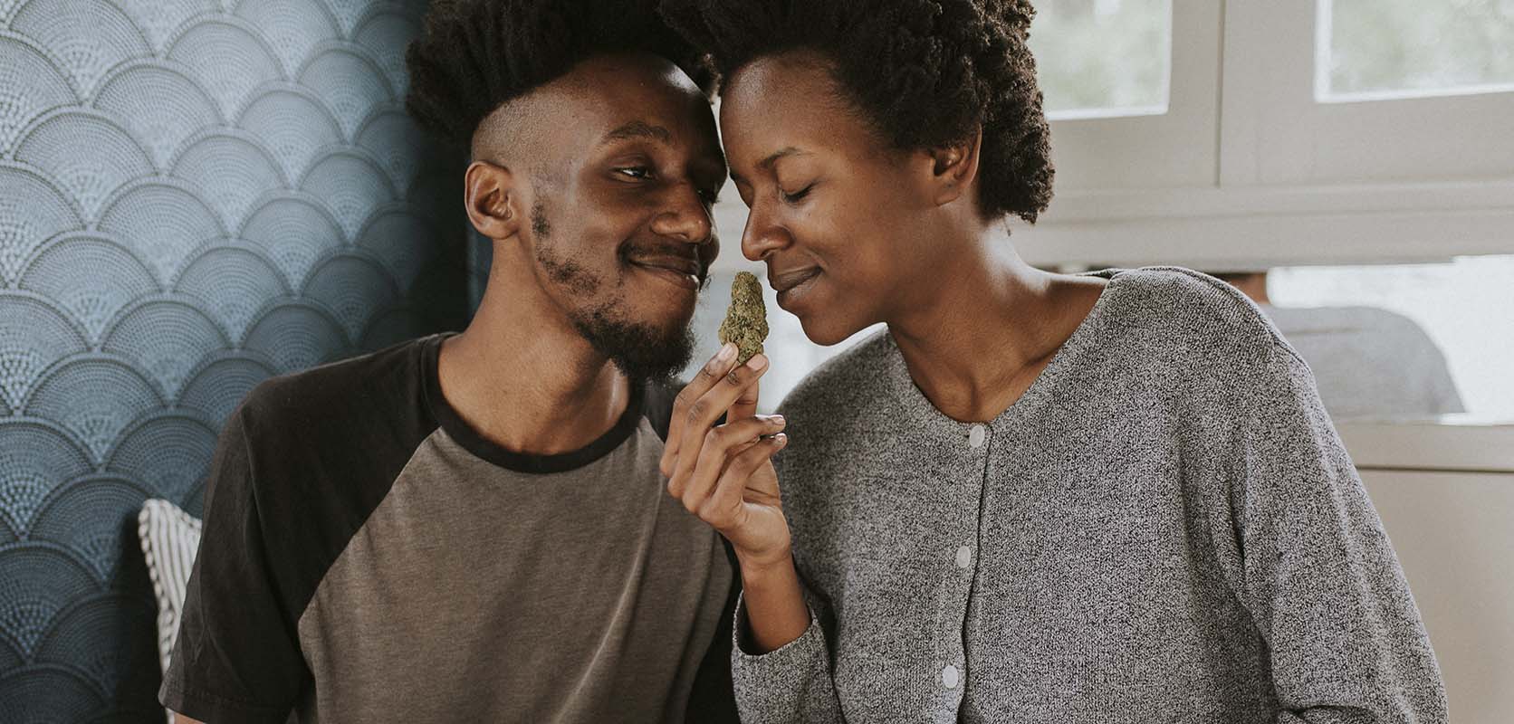 happy couple enjoying the smell of the best sativa weed they bought online from west coast cannabis 