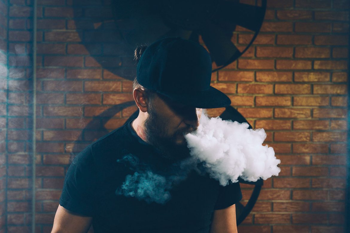 image of man exhaling after dabbing. what is dabbing and how do you dab? buy weed online and thc concentrates online canada.