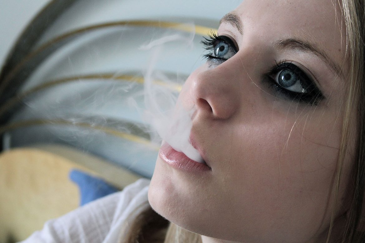 girl smoking weed. Smoke Weed Without A Pipe Or Rolling Papers.